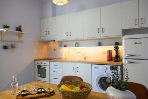 A kitchen or kitchenette at Elounda Luso Apartment