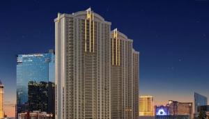 un edificio alto con luces encendidas en una ciudad en The Signature MGM by Zelloo, en Las Vegas