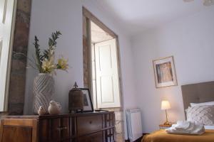 A bed or beds in a room at Cosy Historical House in Lamego - Quinta do Cabo