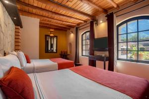 Кровать или кровати в номере Sonesta Posadas del Inca - Valle Sagrado Yucay Urubamba