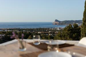 a table with a view of the ocean at Victoria Sunset Suites in San Antonio