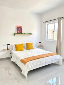 Vila de Santiago Apartment में एक कमरे में एक या कई बेड