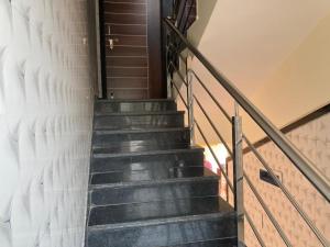 a staircase leading up to a building with a door at Hotel Sai viraj palace in Shirdi