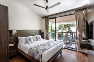 เตียงในห้องที่ Riva Boutique Apartments