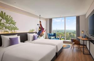 Llit o llits en una habitació de Hyatt Centric Hebbal Bengaluru