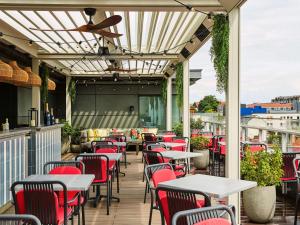 a row of tables and chairs on a patio at Sofitel Brussels Europe in Brussels