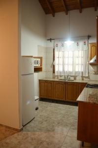 A kitchen or kitchenette at "LA CASONA MARTINEZ" - GH Departamentos