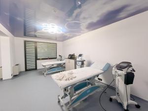 a hospital room with two beds and a window at Hotel & MedSpa Siret in Mamaia