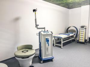 a hospital room with a toilet and a bed at Hotel & MedSpa Siret in Mamaia