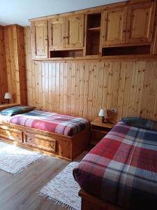 Una cama o camas en una habitación de Bormio Flat