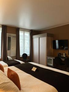 Кровать или кровати в номере HOTEL & SPA Le Renard Centre