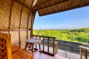 Un balcon sau o terasă la D Sebuluh Bungalow