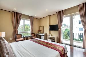 Ліжко або ліжка в номері La Palma - Garden Saigon Hotel Phu My Hung