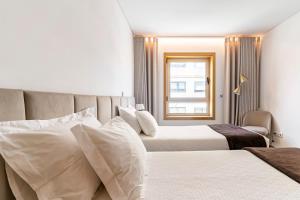 A bed or beds in a room at Breeze Apartment - Matosinhos