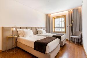 A bed or beds in a room at Breeze Apartment - Matosinhos