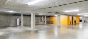 an empty parking garage with two bikes parked in it at B&B HOTEL Thionville Centre Gare Porte du Luxembourg A31 in Thionville