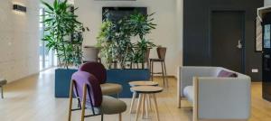 a room with a bunch of potted plants at B&B HOTEL Thionville Centre Gare Porte du Luxembourg A31 in Thionville