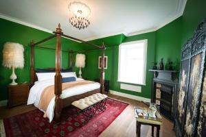 A bed or beds in a room at Ardrhu House Fort William - Serviced Luxury Scots Baronial Country House