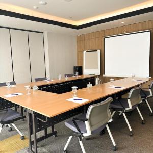 a conference room with a large table and chairs at Citadines Sudirman Jakarta in Jakarta