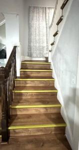 a stairway with wooden steps and a window at Getaway at Falls-3 Beds-Slips 6 in Niagara Falls