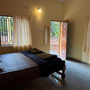 Voodi või voodid majutusasutuse Wild Village Stay Gokarna toas