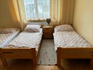 Cama ou camas em um quarto em Pokoje Gościnne U Gordona