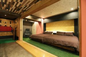 Säng eller sängar i ett rum på MolinHotels501 定山渓温泉付き別荘 -札幌国際スキー場まで20分-1L2Room W-Bed4&S-6 10persons