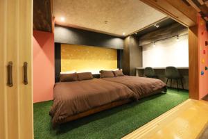 Säng eller sängar i ett rum på MolinHotels501 定山渓温泉付き別荘 -札幌国際スキー場まで20分-1L2Room W-Bed4&S-6 10persons