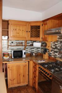 A cozinha ou cozinha compacta de Ravina Apartment - Auronzo Center -