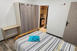 Cama ou camas em um quarto em Appartement Kantar - Le Vert D'Agate