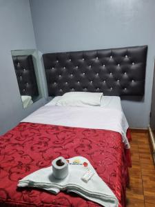 A bed or beds in a room at Hostal Chavin