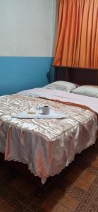 A bed or beds in a room at Hostal Chavin