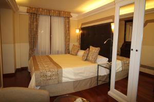 Cama ou camas em um quarto em Hotel Le Isole