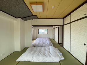 Katil atau katil-katil dalam bilik di 3F Suite Room PayPayドーム Mark Isや大濠公園近く天神駅博多駅から乗り換えなし