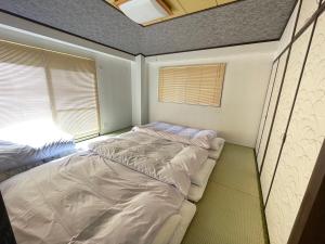 Katil atau katil-katil dalam bilik di 3F Suite Room PayPayドーム Mark Isや大濠公園近く天神駅博多駅から乗り換えなし