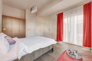 Krevet ili kreveti u jedinici u objektu ARI Central Grand Apartments - Luxurious Stay