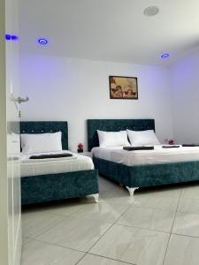 Giường trong phòng chung tại Hotel Ersi