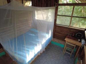 A bed or beds in a room at hostal pakal