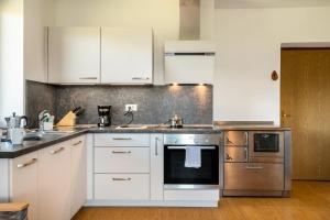 A kitchen or kitchenette at Gatscherhof Apt Abendrot