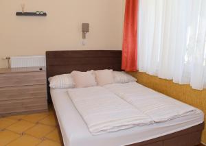 Cama ou camas em um quarto em Makotel Apartmanház