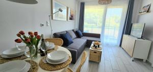 אזור ישיבה ב-Apartament Lato Jantar Resort by TriApart