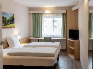 B&B HOTEL Fulda-Hbf房間的床