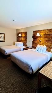 a hotel room with two beds in a room at Browns Canyon Inn in Salida