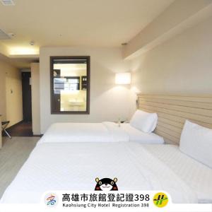 Katil atau katil-katil dalam bilik di Kindness Hotel-Qixian