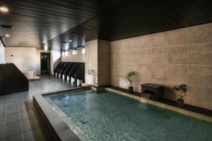 The swimming pool at or close to REF Matsuyama City Station by VESSEL HOTELS