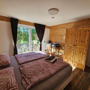 A bed or beds in a room at Villa am Hegensteinbach