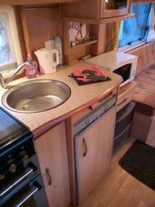 A kitchen or kitchenette at Camping du Puy Rond