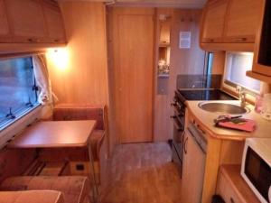 A kitchen or kitchenette at Camping du Puy Rond