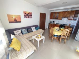 a living room with a couch and a table at Villa Orada in Brela