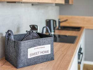 a gray bag sitting on a counter in a kitchen at Townhome Hotel Hannover - Digital Access - kontaktloser Check-in in Hannover